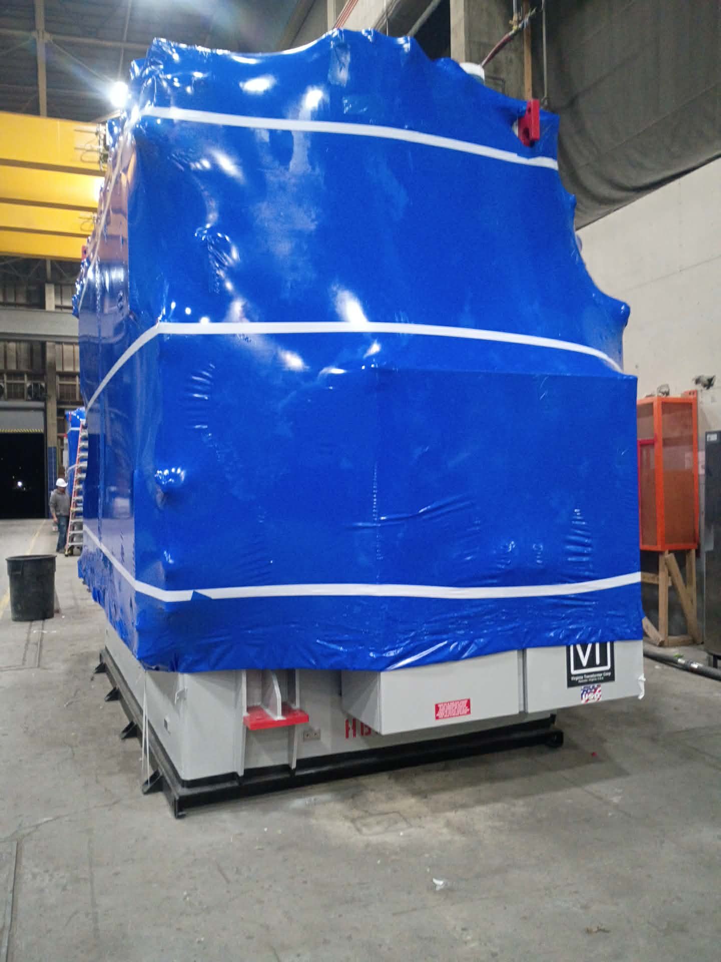 Shrink-wrapped Virginia Transformer Corp unit with reinforced banding ready for shipment